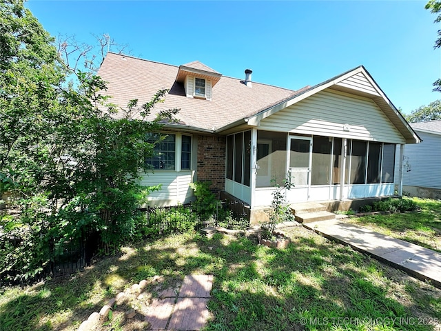 5371 Hilltop, Mcalester, OK 74501 - view of front of property featuring a sunroom and a shingled roof