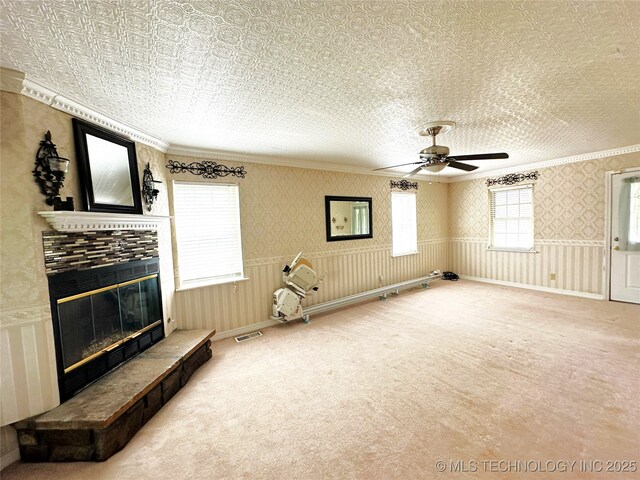 5371 Hilltop, Mcalester, OK 74501 - unfurnished room with ornamental molding, a tiled fireplace, carpet flooring, and ceiling fan