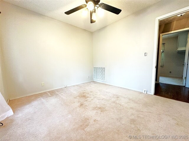 5371 Hilltop, Mcalester, OK 74501 - carpeted spare room featuring ceiling fan and a textured ceiling