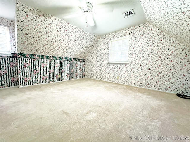 5371 Hilltop, Mcalester, OK 74501 - additional living space with wallpapered walls, carpet, ceiling fan, healthy amount of natural light, and lofted ceiling