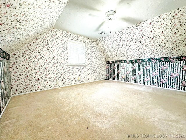 5371 Hilltop, Mcalester, OK 74501 - additional living space with wallpapered walls, carpet, a ceiling fan, and vaulted ceiling