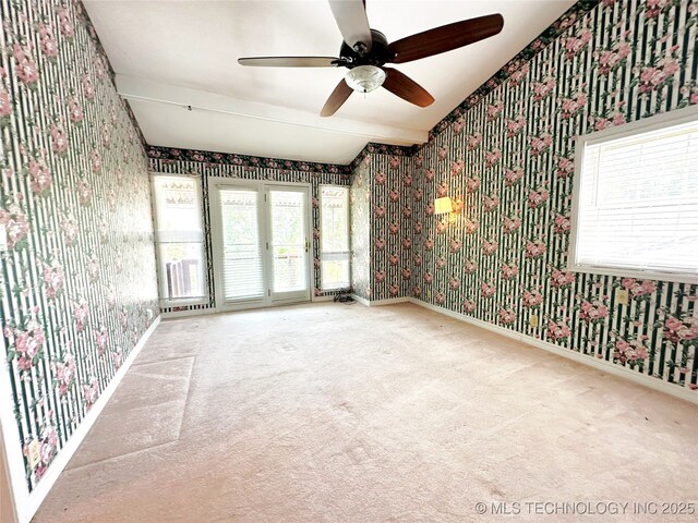 5371 Hilltop, Mcalester, OK 74501 - carpeted empty room featuring wallpapered walls, a ceiling fan, and plenty of natural light