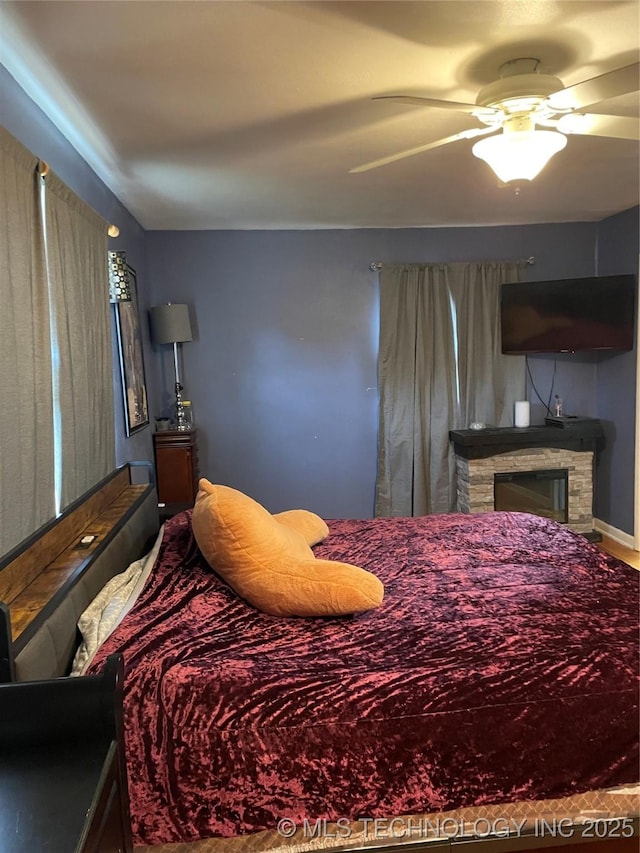 2509 Canterbury Ave, Muskogee, OK 74403 - bedroom with a ceiling fan and a fireplace