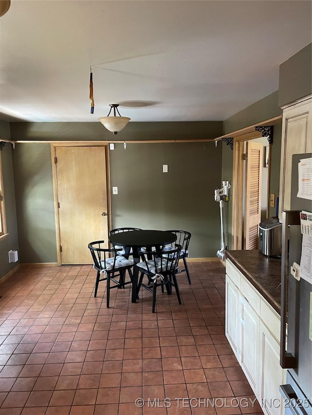 2509 Canterbury Ave, Muskogee, OK 74403 - tiled dining area with baseboards
