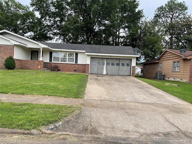 2509 Canterbury Ave, Muskogee, OK 74403 - single story home featuring brick siding, a garage, driveway, a front yard, and crawl space