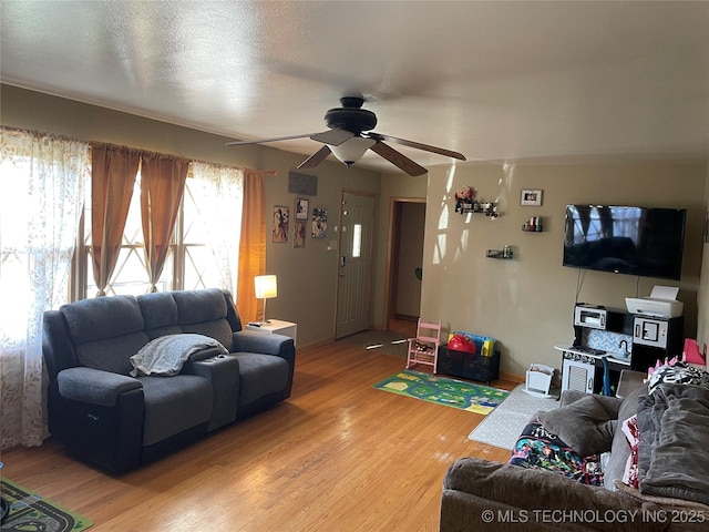 2509 Canterbury Ave, Muskogee, OK 74403 - living room featuring a ceiling fan and light wood-type flooring
