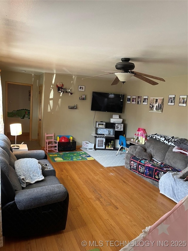 2509 Canterbury Ave, Muskogee, OK 74403 - living area featuring ceiling fan and wood finished floors