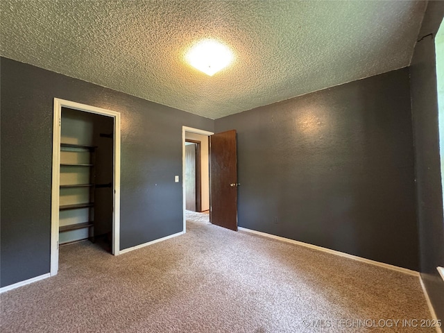 1516 Timber Ridge Dr, Cleveland, OK 74020 - unfurnished bedroom featuring a textured ceiling, carpet flooring, and a closet