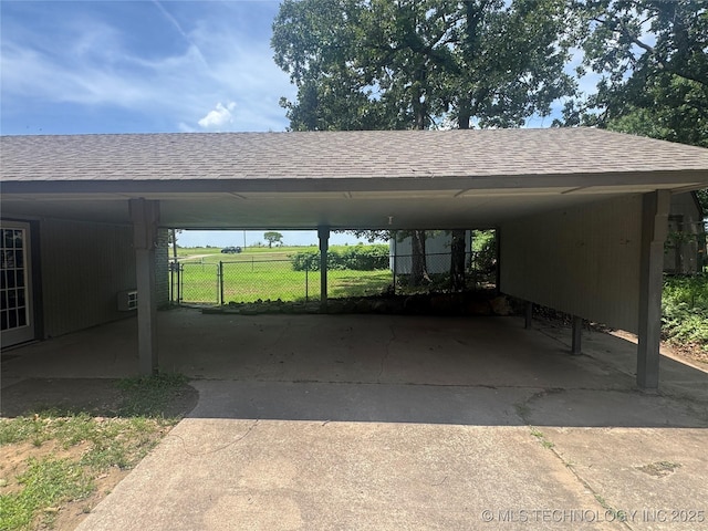 1516 Timber Ridge Dr, Cleveland, OK 74020 - view of parking / parking lot featuring concrete driveway and a carport