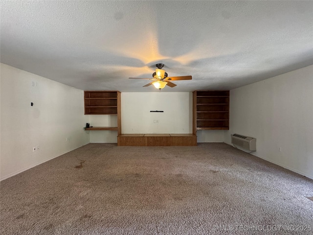 1516 Timber Ridge Dr, Cleveland, OK 74020 - empty room featuring carpet, ceiling fan, a textured ceiling, and a wall unit AC