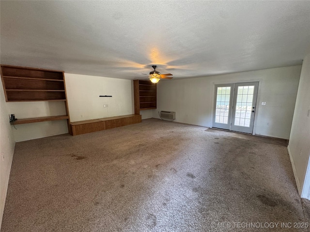 1516 Timber Ridge Dr, Cleveland, OK 74020 - unfurnished living room featuring a wall mounted AC, a ceiling fan, carpet floors, and a textured ceiling
