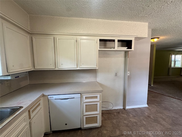 1516 Timber Ridge Dr, Cleveland, OK 74020 - kitchen with dishwasher, a textured ceiling, and light countertops