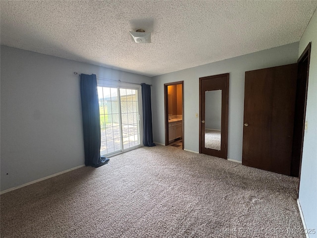 1516 Timber Ridge Dr, Cleveland, OK 74020 - unfurnished bedroom with carpet, a textured ceiling, and two closets