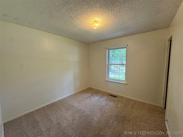 1516 Timber Ridge Dr, Cleveland, OK 74020 - carpeted empty room featuring a textured ceiling and baseboards