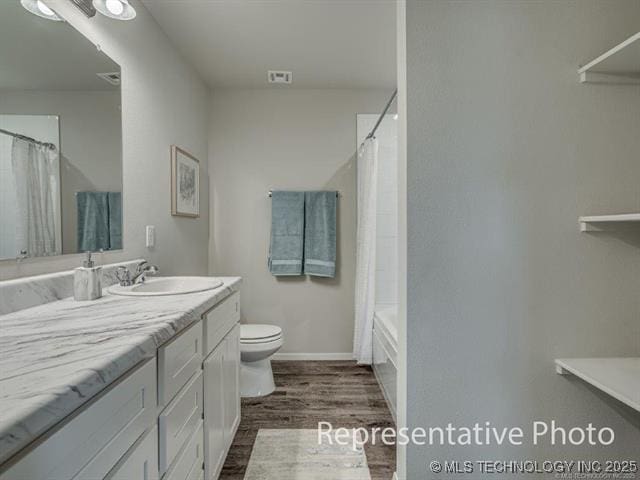 1105 W Lawton Rd, Claremore, OK 74019 - full bathroom featuring vanity, wood finished floors, and shower / tub combo with curtain