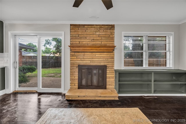 5941 S Utica Ave, Tulsa, OK 74105 - unfurnished living room featuring crown molding, wood finished floors, ceiling fan, and plenty of natural light