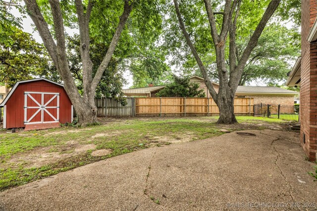 5941 S Utica Ave, Tulsa, OK 74105 - fenced backyard with a storage unit