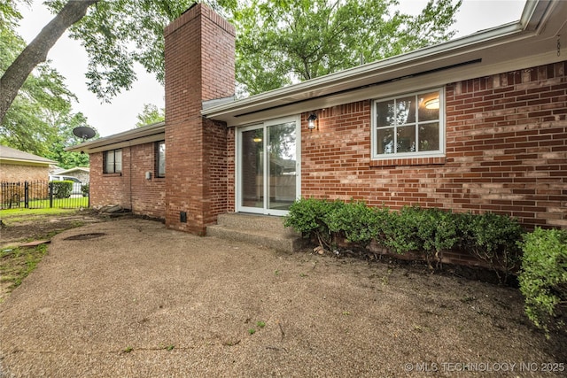 5941 S Utica Ave, Tulsa, OK 74105 - back of property with a chimney and brick siding