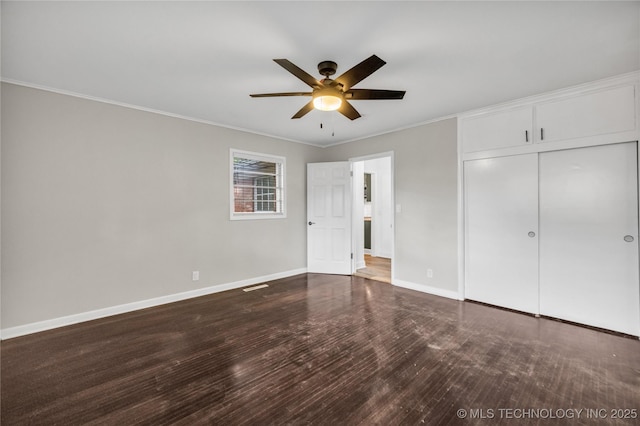 5941 S Utica Ave, Tulsa, OK 74105 - unfurnished bedroom featuring ornamental molding, wood finished floors, a closet, and ceiling fan