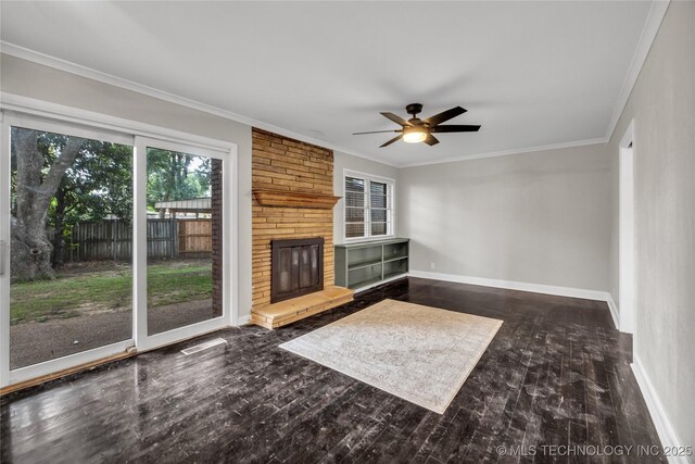 5941 S Utica Ave, Tulsa, OK 74105 - unfurnished living room with ceiling fan, ornamental molding, wood finished floors, and a brick fireplace