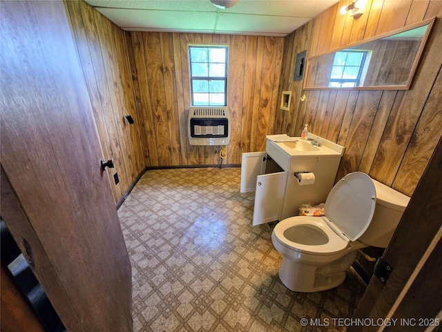 6850 E County Road 553, Kansas, OK 74347 - half bathroom featuring heating unit, tile patterned floors, wooden walls, and vanity
