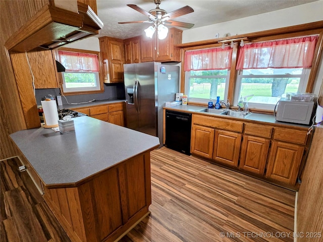 6850 E County Road 553, Kansas, OK 74347 - kitchen with dishwasher, stainless steel refrigerator with ice dispenser, a peninsula, brown cabinets, and a ceiling fan