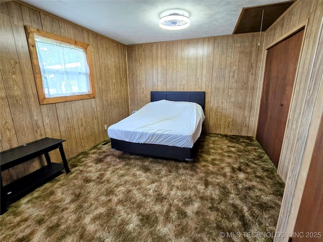 6850 E County Road 553, Kansas, OK 74347 - carpeted bedroom featuring wood walls