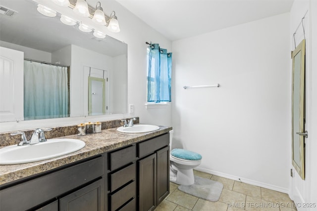 23204 S Jewell Dr, Claremore, OK 74019 - bathroom with double vanity, tile patterned floors, and curtained shower