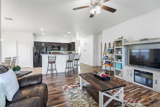 23204 S Jewell Dr, Claremore, OK 74019 - living room with wood finished floors, ceiling fan, and recessed lighting