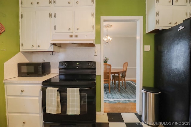 1127 S Richmond Ave, Tulsa, OK 74112 - kitchen featuring black appliances, under cabinet range hood, white cabinets, tile patterned floors, and light countertops