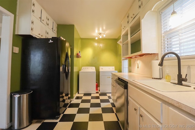 1127 S Richmond Ave, Tulsa, OK 74112 - kitchen with black refrigerator with ice dispenser, independent washer and dryer, stainless steel dishwasher, dark flooring, and light countertops