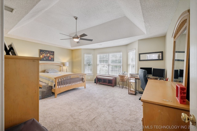 1508 S Kalanchoe Ave, Broken Arrow, OK 74012 - carpeted bedroom with a raised ceiling, a textured ceiling, a desk, and a ceiling fan
