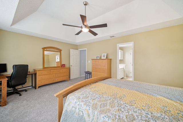 1508 S Kalanchoe Ave, Broken Arrow, OK 74012 - bedroom featuring light colored carpet, a tray ceiling, an office area, and a ceiling fan
