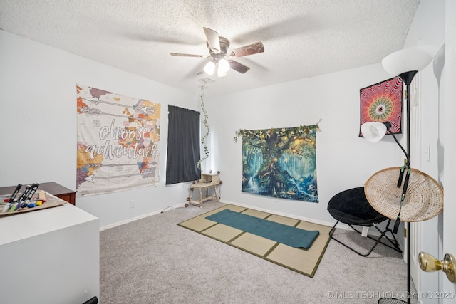1508 S Kalanchoe Ave, Broken Arrow, OK 74012 - rec room with ceiling fan, carpet floors, and a textured ceiling