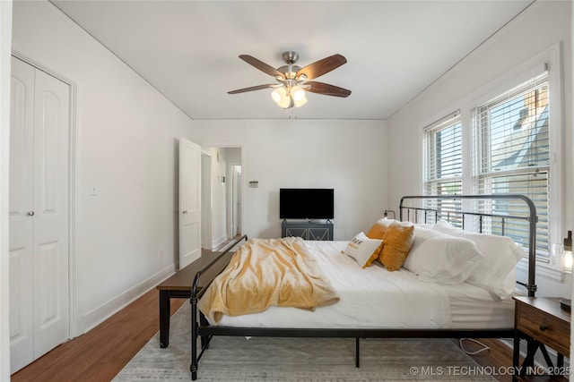 1516 S Lewis Pl, Tulsa, OK 74104 - bedroom with wood finished floors and ceiling fan