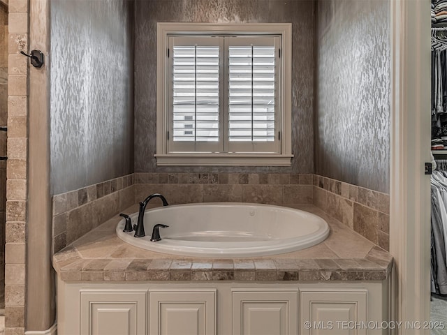 10741 S 93rd E Ave, Tulsa, OK 74133 - bathroom with a garden tub and a spacious closet