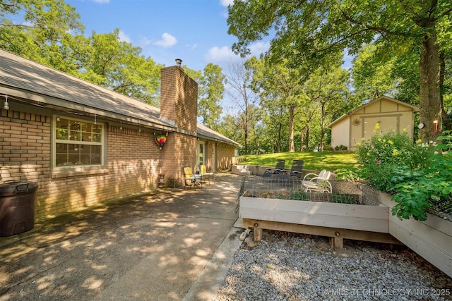 16 Big Bluff St, Pryor, OK 74361 - view of patio with a storage shed
