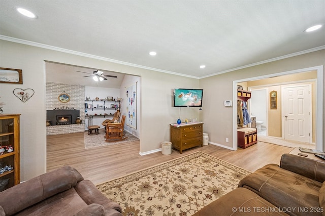 16 Big Bluff St, Pryor, OK 74361 - living area with wood finished floors, a ceiling fan, recessed lighting, crown molding, and a fireplace