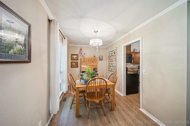 16 Big Bluff St, Pryor, OK 74361 - dining room with a chandelier, light wood-type flooring, and crown molding