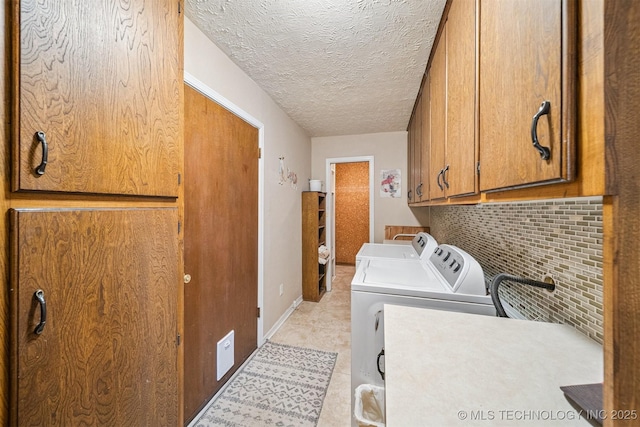 16 Big Bluff St, Pryor, OK 74361 - laundry room with washer and dryer, cabinet space, and a textured ceiling