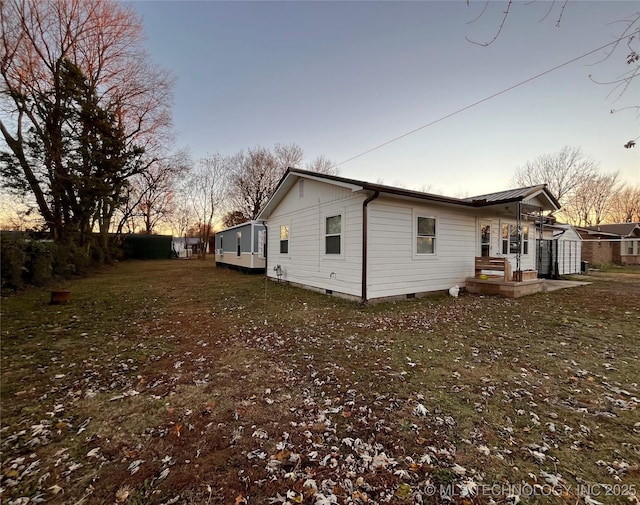 1763 Bryan St, Westville, OK 74965 - property exterior at dusk featuring crawl space