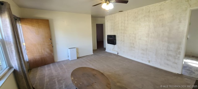 1763 Bryan St, Westville, OK 74965 - spare room featuring carpet flooring, a ceiling fan, and heating unit