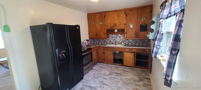1763 Bryan St, Westville, OK 74965 - kitchen featuring black fridge with ice dispenser, brown cabinets, stainless steel range with electric stovetop, and decorative backsplash