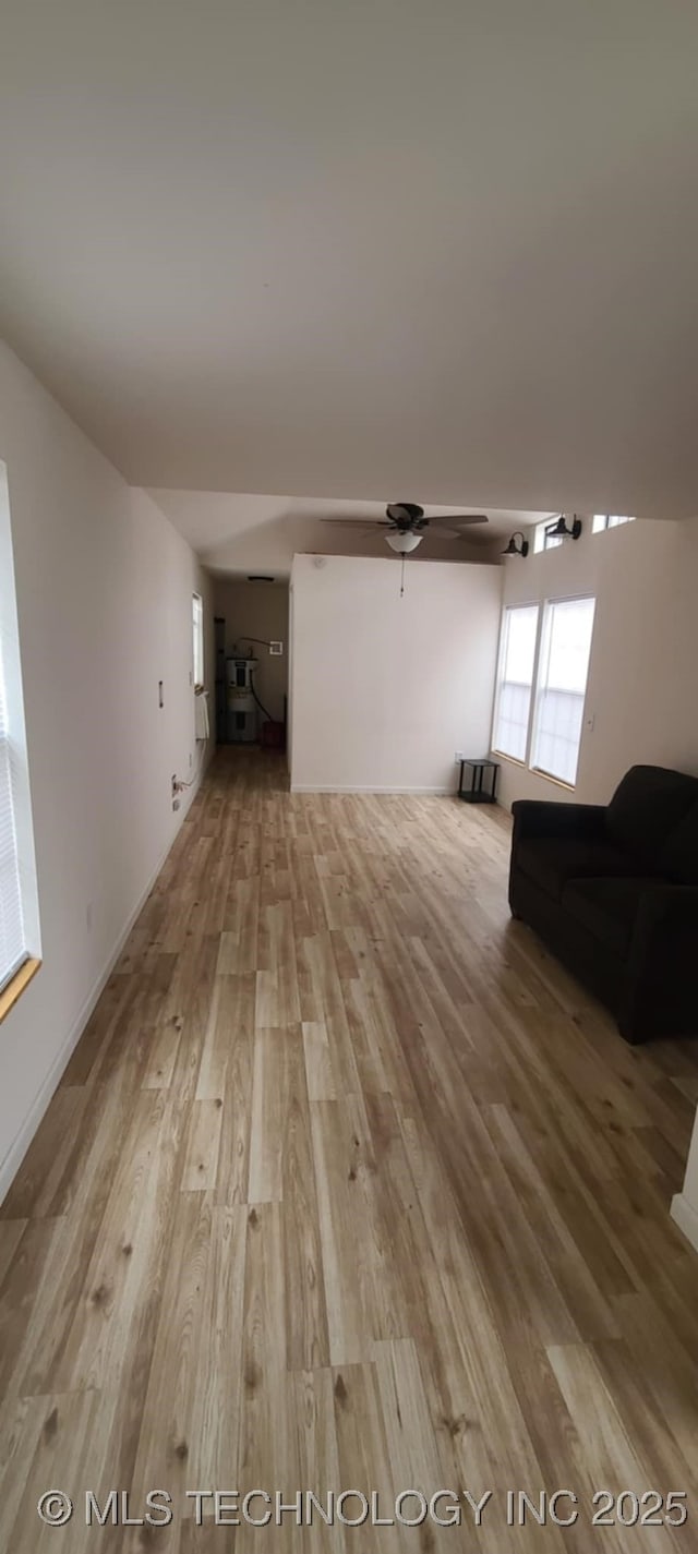 1763 Bryan St, Westville, OK 74965 - unfurnished living room featuring wood finished floors and a ceiling fan