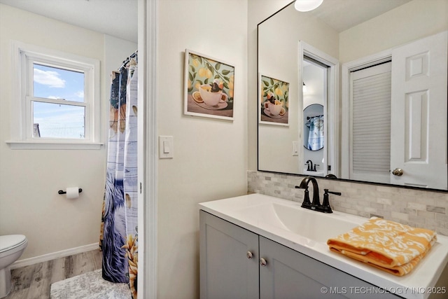 3316 E 88th St, Tulsa, OK 74137 - bathroom featuring wood finished floors, vanity, backsplash, and curtained shower