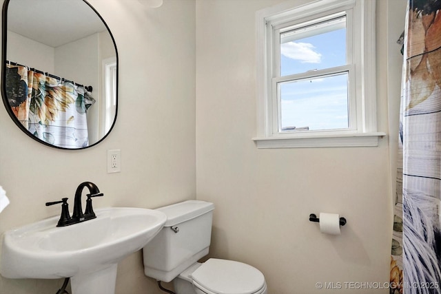 3316 E 88th St, Tulsa, OK 74137 - bathroom with toilet and curtained shower