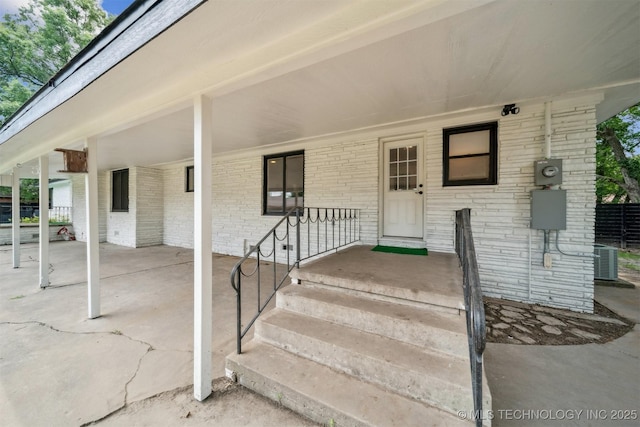 215 S Elliott St, Pryor, OK 74361 - property entrance featuring brick siding
