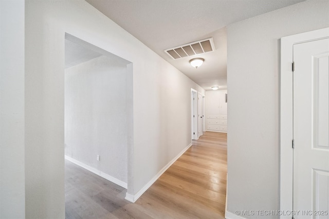 215 S Elliott St, Pryor, OK 74361 - corridor with wood finished floors and baseboards