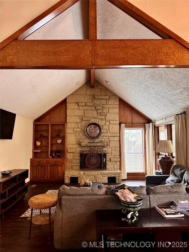 8448 S Florence Ave, Tulsa, OK 74137 - living area featuring wood finished floors, a textured ceiling, and a stone fireplace