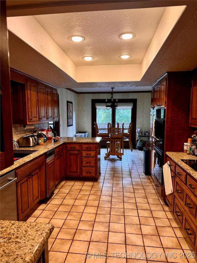 8448 S Florence Ave, Tulsa, OK 74137 - kitchen with a textured ceiling, a tray ceiling, light tile patterned floors, tasteful backsplash, and black appliances